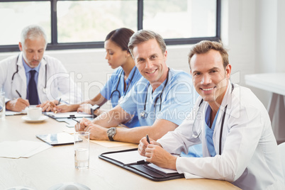 Portrait of doctors smiling in conference room