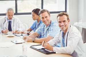 Portrait of doctors smiling in conference room