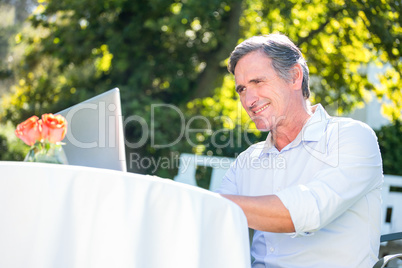 Casual businessman using laptop