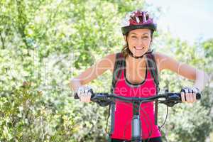 Smiling woman cycling