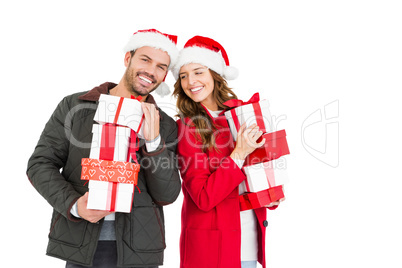 Happy young couple holding gifts