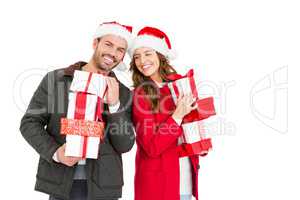 Happy young couple holding gifts