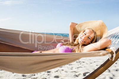 Woman lying in hammock