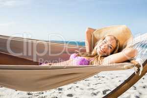 Woman lying in hammock