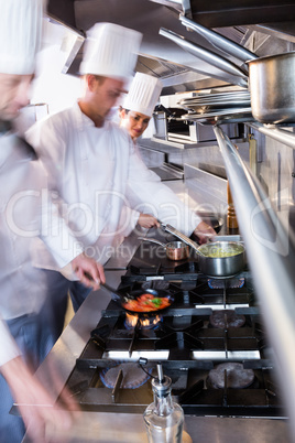 Chefs preparing food in the kitchen