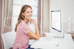 Happy beautiful woman using computer