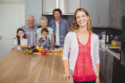 Portrait of smiling family in kitchen