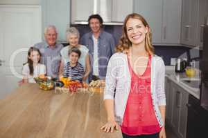 Portrait of smiling family in kitchen