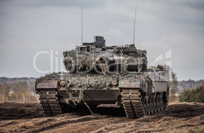 main battle tank stands in position to shoot