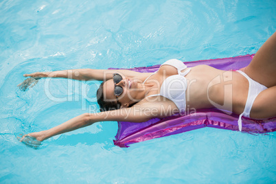 Woman relaxing on inflatable raft