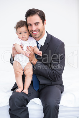 Portrait of smiling father and baby