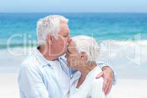 Senior couple embracing and kissing