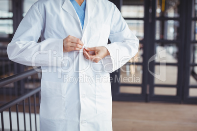 Midsection of doctor wearing lab coat
