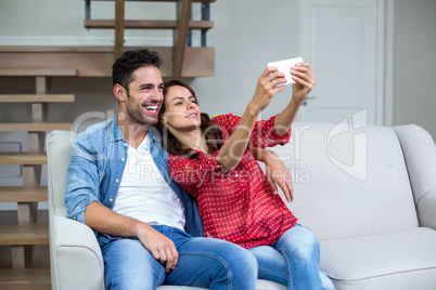 Cheerful couple taking self portrait