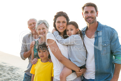 Happy family posing at the beach