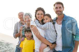 Happy family posing at the beach