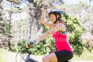 Smiling woman cycling