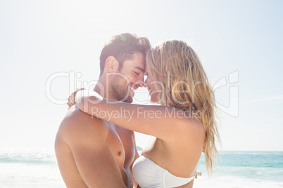 Smiling young couple hugging