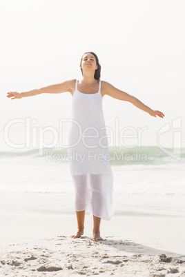 Beautiful woman stretching on the beach