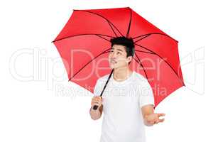 Young man holding umbrella