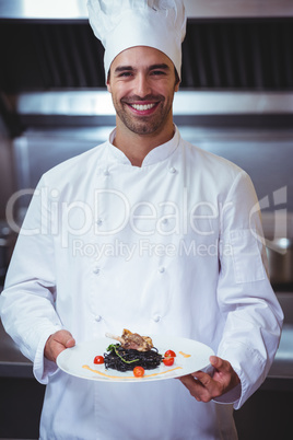 Chef holding his dish