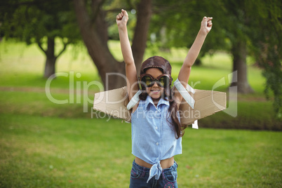 Young girl pretending to fly