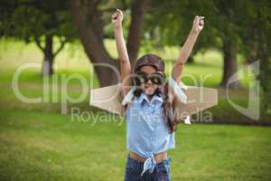 Young girl pretending to fly