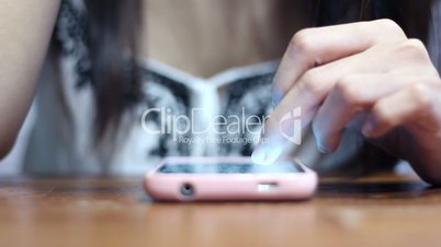 Soft focused young girl browsing smartphone