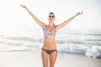 Woman in bikini standing on the beach