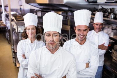 Group of happy chefs smiling at the camera
