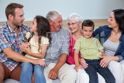 Family sitting on sofa