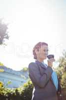 Pretty businesswoman enjoying a glass of wine