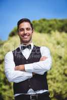 Handsome waiter smiling at camera