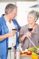 Romantic senior couple with wine glasses