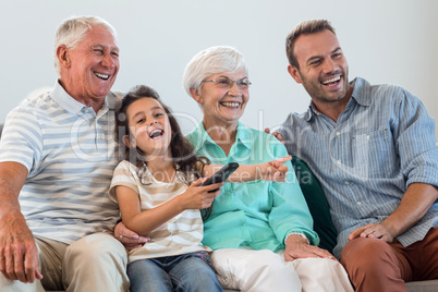 Happy family sitting on sofa