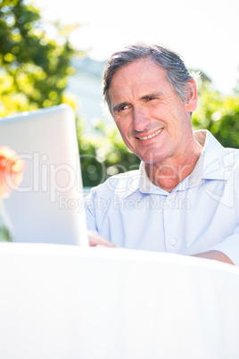 Casual businessman using laptop