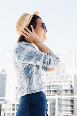 Woman wearing sunglasses and a hat