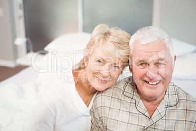 Portrait of happy senior couple in nightwear