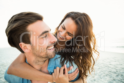 Boyfriend giving piggy back to girlfriend