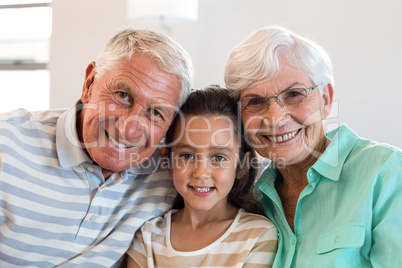Grandmother and grand father with their granddaughter