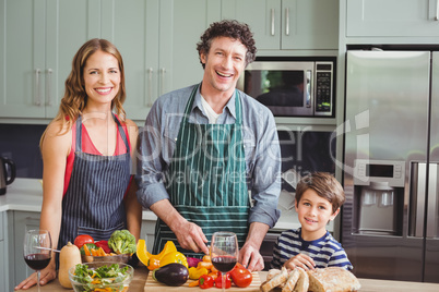 Portrait of happy family in kitchen at home