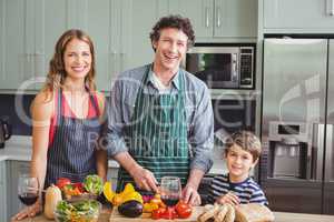Portrait of happy family in kitchen at home