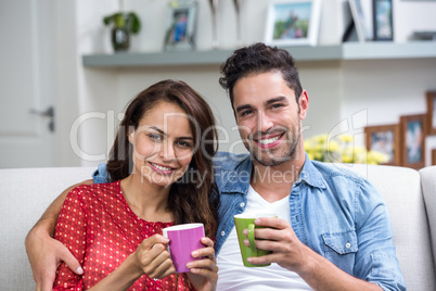 Portrait of smiling couple having coffee