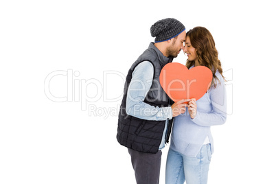 Happy young couple holding heart