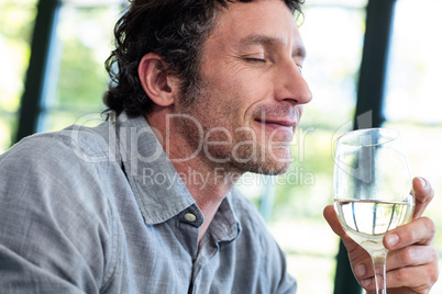 Close-up of man having wine