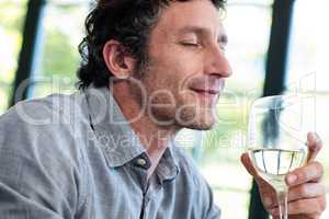 Close-up of man having wine