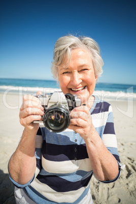 Senior woman taking picture