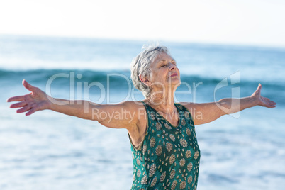 Senior woman outstretching arms