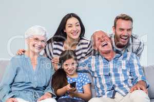 Happy family watching television