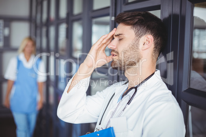 Close-up of male doctor suffering from headache